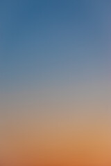 The gradient sky is blue-orange. A wonderful background for design.