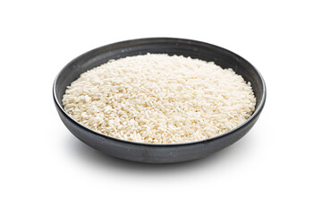 Uncooked Carnaroli risotto rice in bowl isolated on white background.