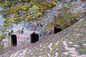 Natural cellars and caves in the red rocks, Ligatne, Gauja National Park, Latvia.
