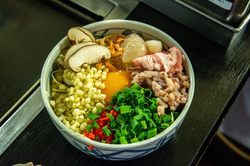 Bowl of ingredients for mixing and cooking the Japanese 'Okonomiyaki' dish on a teppan (flat griddle) in Tokyo, Japan