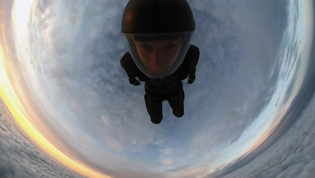 a man falls into a cloud, falling into the clouds from an airplane at sunset, above the clouds