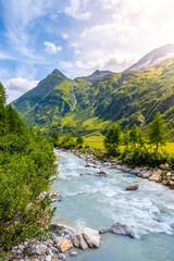 Wild rocky river in alpine valley