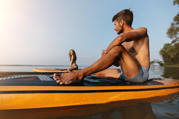 young man sitting on the SAP board .