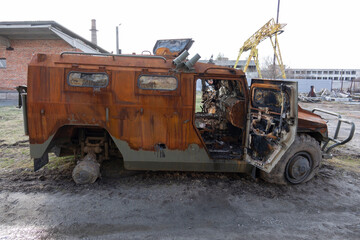 Fototapeta na wymiar Damaged Russian military armored car tiger blown up and burnt.