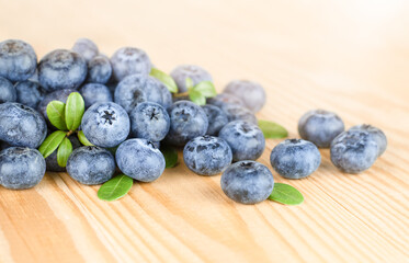 fresh blueberries scattered on a wooden table