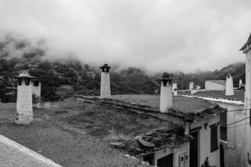 Title: street photos in B/W in the old town of the Pampaneira white village (Pueblo blanco),...