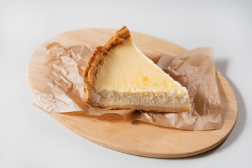 Sweet cheese cake on wooden board