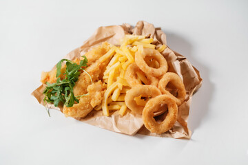 Set of french fries onion rings and chicken wings