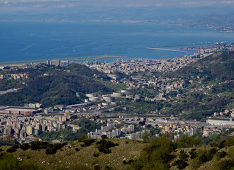 Industrial areas and vegetation on the hills of the city