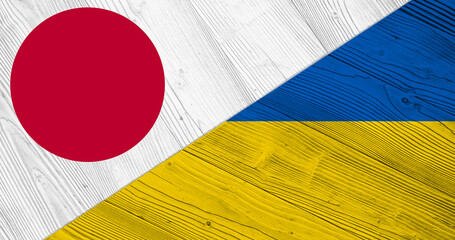 Background with flag of Japan and Ukraine on divided wooden board. 3d illustration