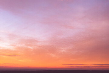 Sunset. Abstract pink sky with yellow clouds