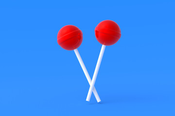 Lollipops on stick on blue background. Sweet candy. Confectionery goods. 3d render