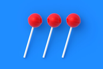 Row of three lollipops on stick on blue background. Sweet candy. Confectionery goods. 3d render