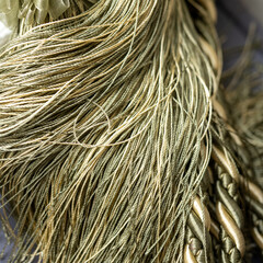 Texture of synthetic golden threads. High quality photo