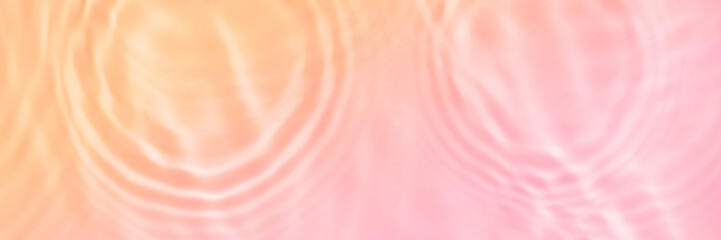 Serum or water texture close up. Light pink and coral gradient liquid gel background. Transparent...