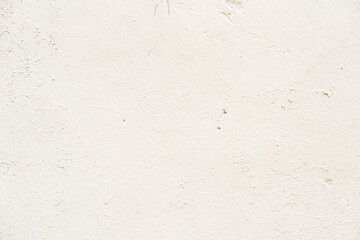 Light painted concrete wall, natural rough texture