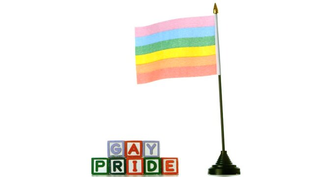 Animation of gay pride text rainbow flag over gay pride text