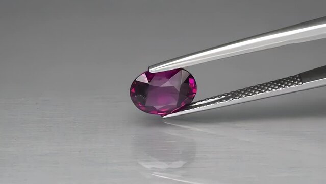 Natural oval cut rhodolite garnet on the turning table
