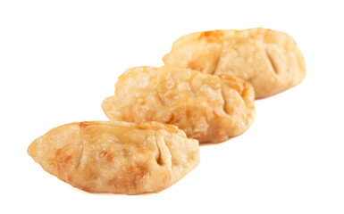 Three Potsticker Dumplings Isolated on a White Background