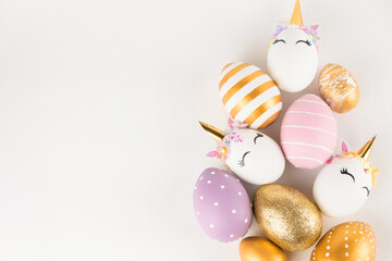 Easter eggs isolated on white background. Happy easter banner. Kids activity inspiration. Greeting card or poster with unicorn egg. Decoration golden, pink. blue eggs