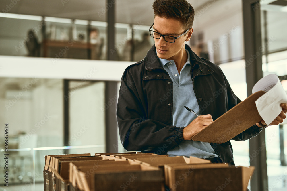 Aufkleber Getting packages on their way. Shot of a courier sorting through boxes for delivery.
