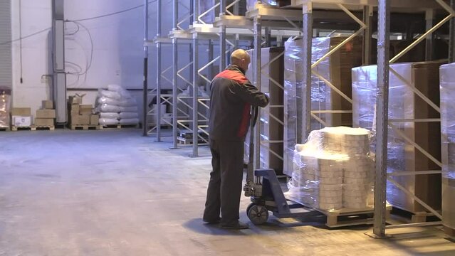 Injury at work. Warehouse worker lying unconscious on the concrete floor after the fall. Dangerous accident at the warehouse. Logistics and safety concept.