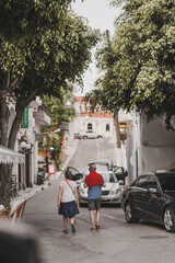 Fototapeta na wymiar People walking in the city, Agios Nikolaos, Greece