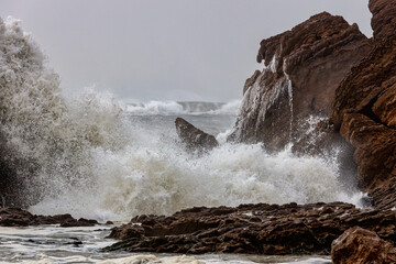 waves crashing on rocks