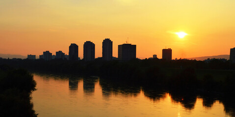 Obraz na płótnie Canvas Evening panorama of Zagreb, Croatia. Sunset at the Sava river banks in Zagreb, Croatia