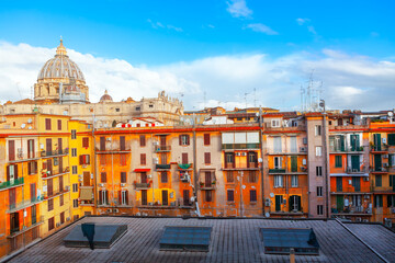 Fototapeta premium Cupola of Saint Peter Basilica and residential houses . Typical residential district in Rome 