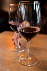 Glass of dry French merlot red wine from Bordeaux, France
