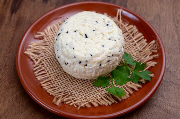 Traditional polish white cheese with black chives seeds made in North Poland in Kaszebe area near...