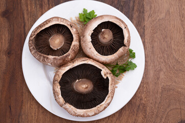 Tasty vegetarian food, large brown champignons Agaricus bisporus portobello mushrooms