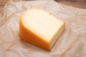 Piece of Dutch Gouda cheese ade from cow milk