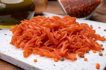 Vegan gluten free and vegetarian food, dried spiral pasta made from orange lentils legumes