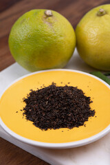 Making tasty aromatic earl-gray tea with fresh ripe bergamot citrus fruit