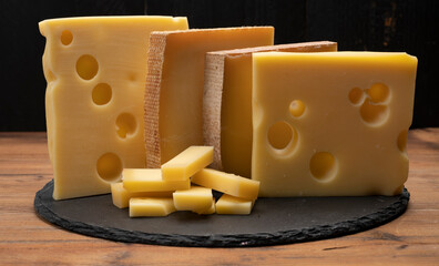 Swiss cheese collection, emmentaler with holes,  gruyere, appenzeller fondue cheeses