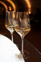 Tasting of brut champagne sparkling wine produced by traditional method in underground caves