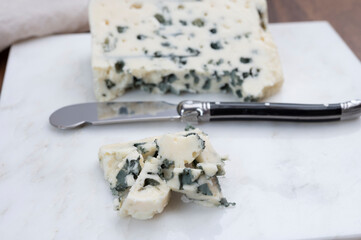 Tastig of French king of cheeses, sheep milk blue cheese roquefort from Southern France,