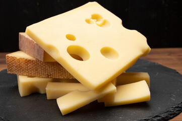 Swiss cheese collection, emmentaler with holes,  gruyere, appenzeller fondue cheeses