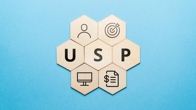 Acronym USP or Unique Selling Proposition. Abstract icons and text on wooden forms
