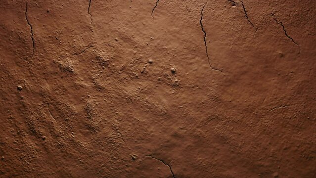Time-lapse of cracked soil, drying brown clay ground texture in desert shot in timelapse. Cracks in soil. Concept of erosion, climate change and global warming. Motion natural background