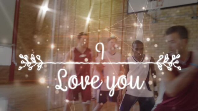 Animation of love you text and spots over diverse group of basketball players at gym