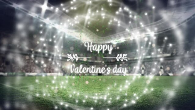 Animation of happy valentine's day text and spots over sports stadium