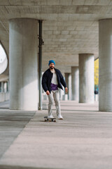 skateboarding boy in the city . Urban architecture. Skate spot. vertical photo