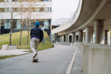  young man skater riding on skateboard. skateboarding city outdoor. Banner copy space
