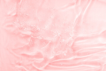 Serum texture swatch with collagen and peptides, clear liquid gel with bubbles background. Pink...