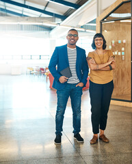 Yes, were the most creative pioneers around. Portrait of two young designers standing together in...