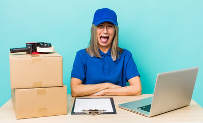 senior gray hair woman shouting aggressively, looking very angry. employee packer concept