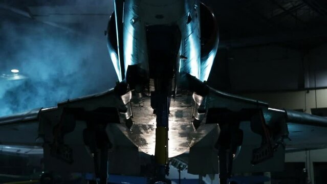 Fighter Jet Awaiting Deployment inside Hangar. Low Angle View. 